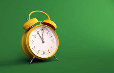 Yellow vintage alarm clock time lapse copy space green background	
