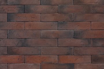 Texture of reddish-brown rectangular bricks wall, background
