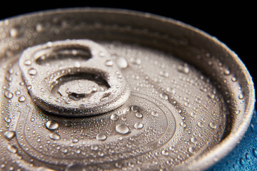 Close-up photo of aluminum closed jar of beer, coke, soda with condensation water drops against...
