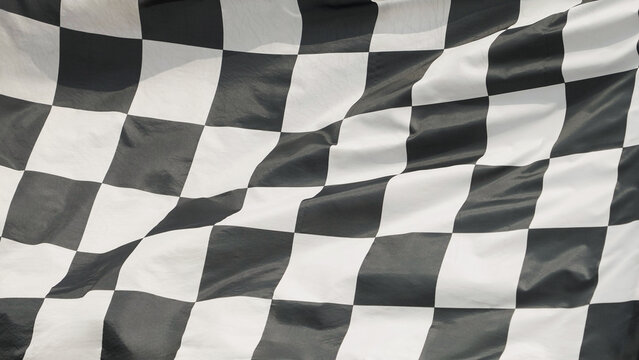 win winner checkered flag Black and white waving on  on post sign of final round end of line racing motor sport competition game. checkered flag 