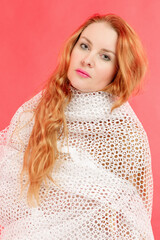 Portrait of a beautiful red-haired woman wrapped in a mesh cape - 762262821
