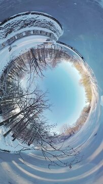 Embark on a captivating journey through a serene winter forest in this 360-degree video. The immersive footage transports you to a tranquil snow-covered landscape, where you ll feel like youre walking