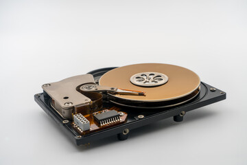 HDD, Hard disk drive, platters, circular magnetic disk. Actuator arm with read write head. Central...