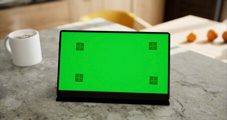 Tablet place on kitchen table, Green screen touchscreen, Close up display digital with mock up