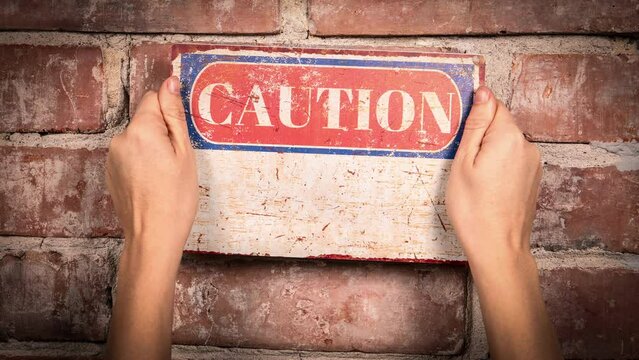 Compliance concept. Caution sign with text on brick wall background