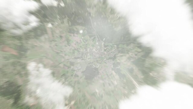 Earth zoom in from space to Tukums, Latvia. Followed by zoom out through clouds and atmosphere into space. Satellite view. Travel intro. Images from NASA