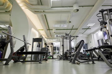 Modern gym room with fitness equipment.