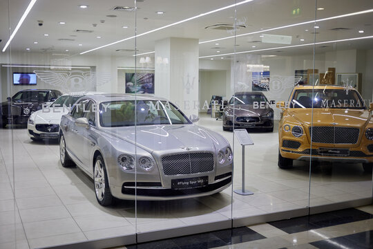 Cars Bentley and Mazerati in showroom in Radisson Slavyanskaya Hotel and Business Center.