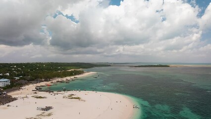 Zanzibar beach where tourists and locals mix together of colors and joy, concept of summer vacation, aerial view of Kendwa beach, Tanzania, Timelapse shot at 24 fps