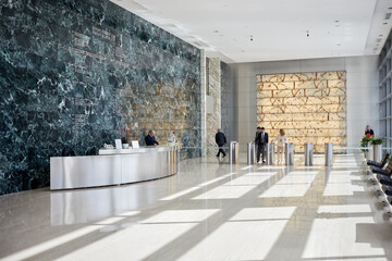 People in reception hall of Ducat Place III - one of the most famous and high-quality office...