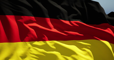 Close-up of the national flag of Germany flutters in the wind on a sunny day