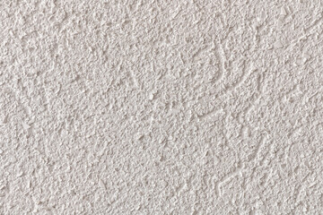 abstract background of white embossed plastered wall painted white macro texture