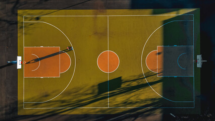 Public basketball court top down aerial image. Sports and healthy lifestyle concept