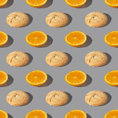 Seamless pattern of white fresh orange slice cookies with orange slices