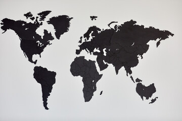 Dark grey world map on wall.