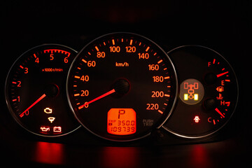 Fototapeta premium Car dashboard glowing in dark.