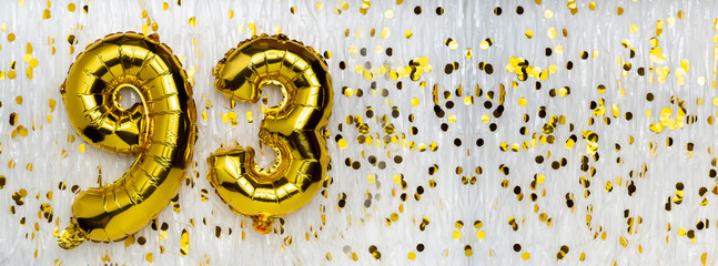 Gold foil balloon number, digit ninety-three. Birthday greeting card with inscription 93....