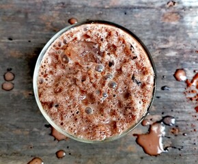 Iced chocolate drink on wood background