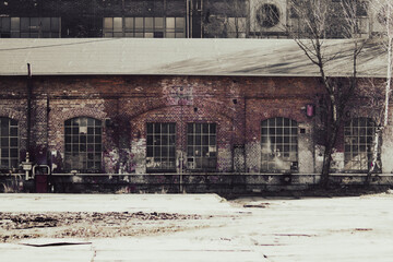 Abandoned industrial building in the city. Filtered image processed vintage effect.