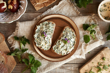 Nettle butter - homemade bread spread made of wild edible plants harvested in spring, with lungwort...