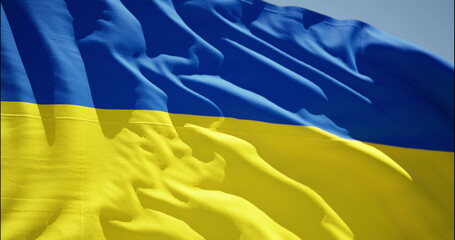 Slow motion of Ukraine flag waving background sky blue and yellow national color. Highly detailed fabric texture flag of Ukraine