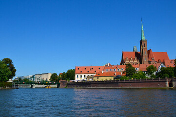 The Cathedral Island (polish: Ostrow Tumski), the oldest part of the city of Wrocław, Poland. View from the boat trip on Oder river. Collegiate Church of the Holy Cross and St. Bartholomew.