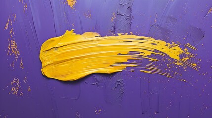 Bright yellow oil paint smear on purple background.