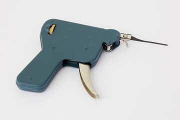 Manual lock pick gun tool for unlocking on white background.