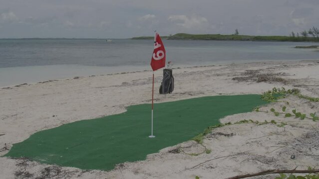 Small mini golf green patch on Bahamas beach