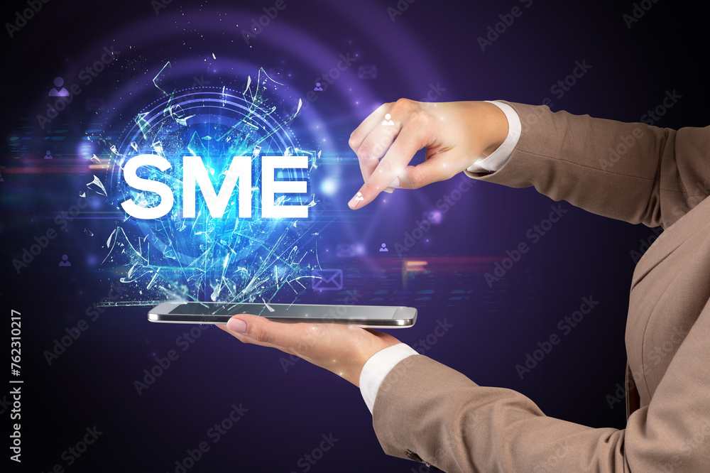 Poster close-up of a touchscreen with abbreviation.