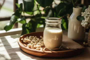 Fotobehang Crafting homemade cashew milk. Velvety cashew milk highlighting the creaminess and versatility of this plant-based alternative. © DK_2020