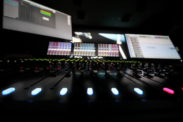 Recording studio with equipment on movie studio, cinema display out of focus, shallow dof
