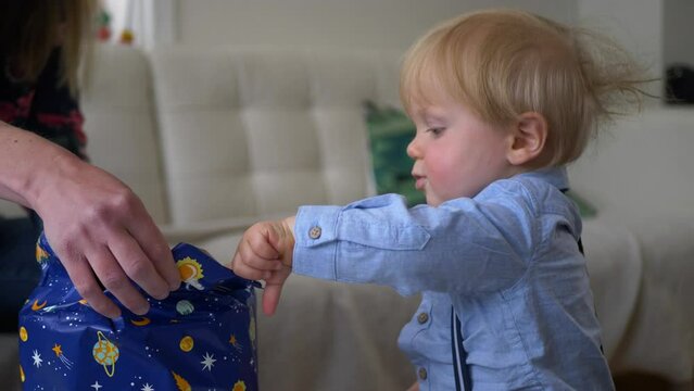 Little boy turns 1 year old and opens his birthday presents 4