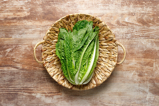 Romaine lettuce in a basket, top down view