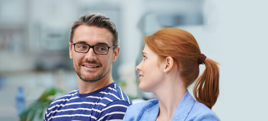 Man, woman and smile in startup office for conversation, team or advice for decision at company....