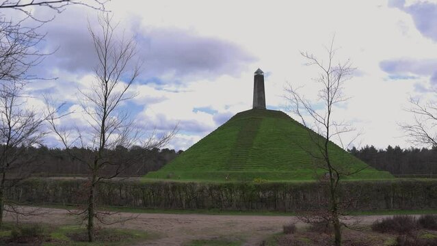 One of the highest points of the Utrecht Hill Ridge, Woudenberg. View of the Pyramide van Austerlitz in Zeist, Netherlands on a cloudy day of spring 4k