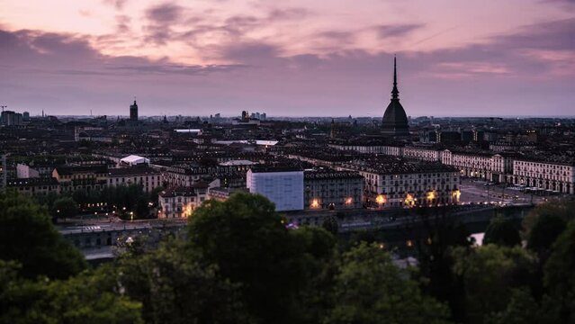 Day to night winter sunset timlepase panorama of Turin city Mole Antonelliana