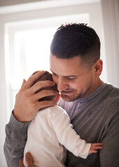 Dad, baby and pride with hug for bonding, love and happiness with child development and parenting. Peace, calm and childhood with smile, man and newborn infant for tender moment at family home