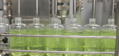 chemical liquid filling sanitiser bottles gel fills in bottle soap hand wash detergent production line filling making process in a plastic transparent bottle manufacturing factory