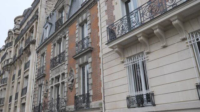 Facades of the buildings in Paris with classic architecture.