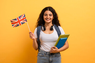 Student with UK flag and notebooks