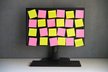 Blank colorful sticky notes reminders on computer monitor - 762347417