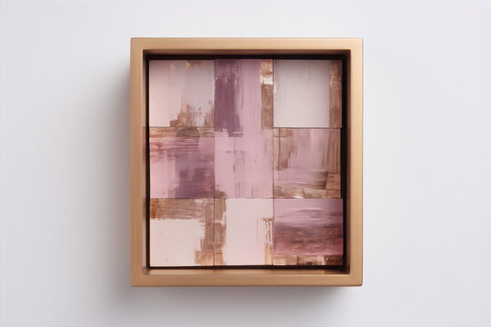 Abstract painting with pink, white and gold colors in a gold frame