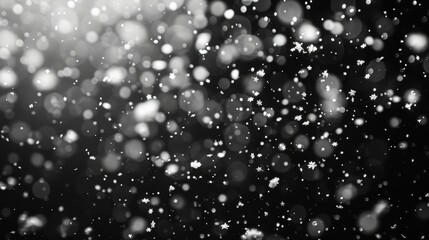 On a black background, falling snow is seen.
