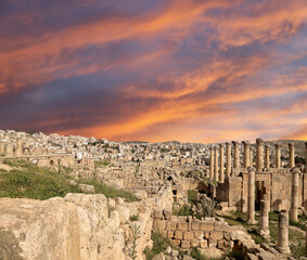 Roman ruins (against the background of a beautiful sky with clouds) in the Jordanian city of Jerash (Gerasa of Antiquity), capital and largest city of Jerash Governorate, Jordan