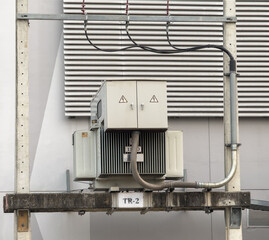 Electrical transformer on top of a concrete pole