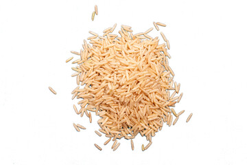 Whole grain uncooked basmati rice heaped on empty background