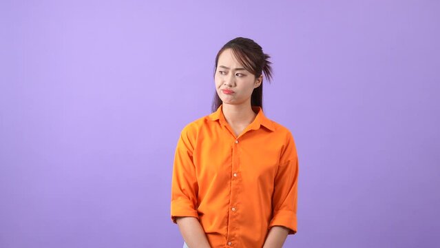 The Asian woman pondered her plan and finally shrugged her shoulders at the impasse
