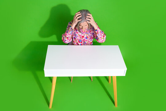 Full length top view photo of furious sad lady dressed blouse feeling headache isolated green color background