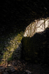 broken basement sunlight coming through a collapsed wall